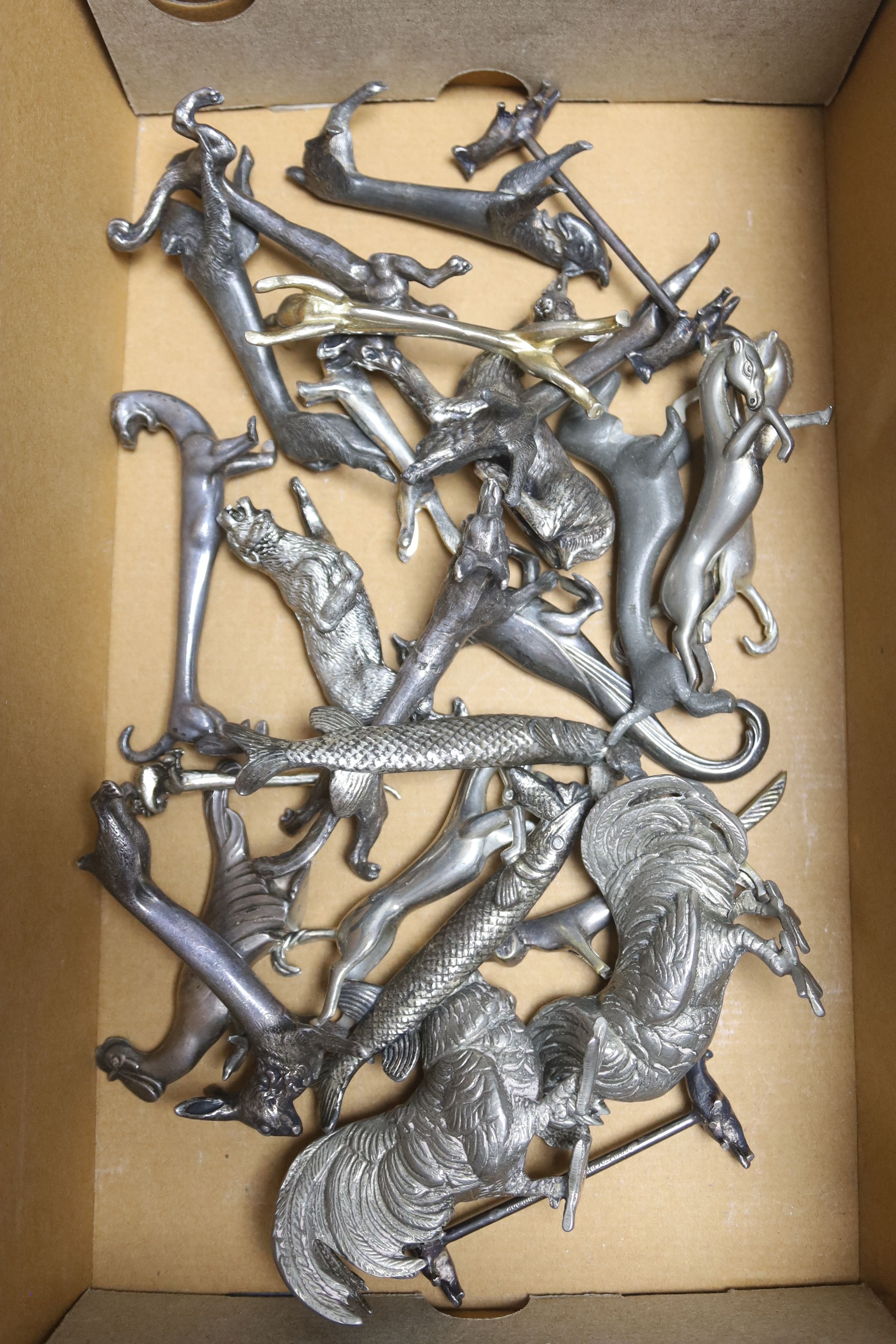 A collection of animal shaped plated and spelter knife rests